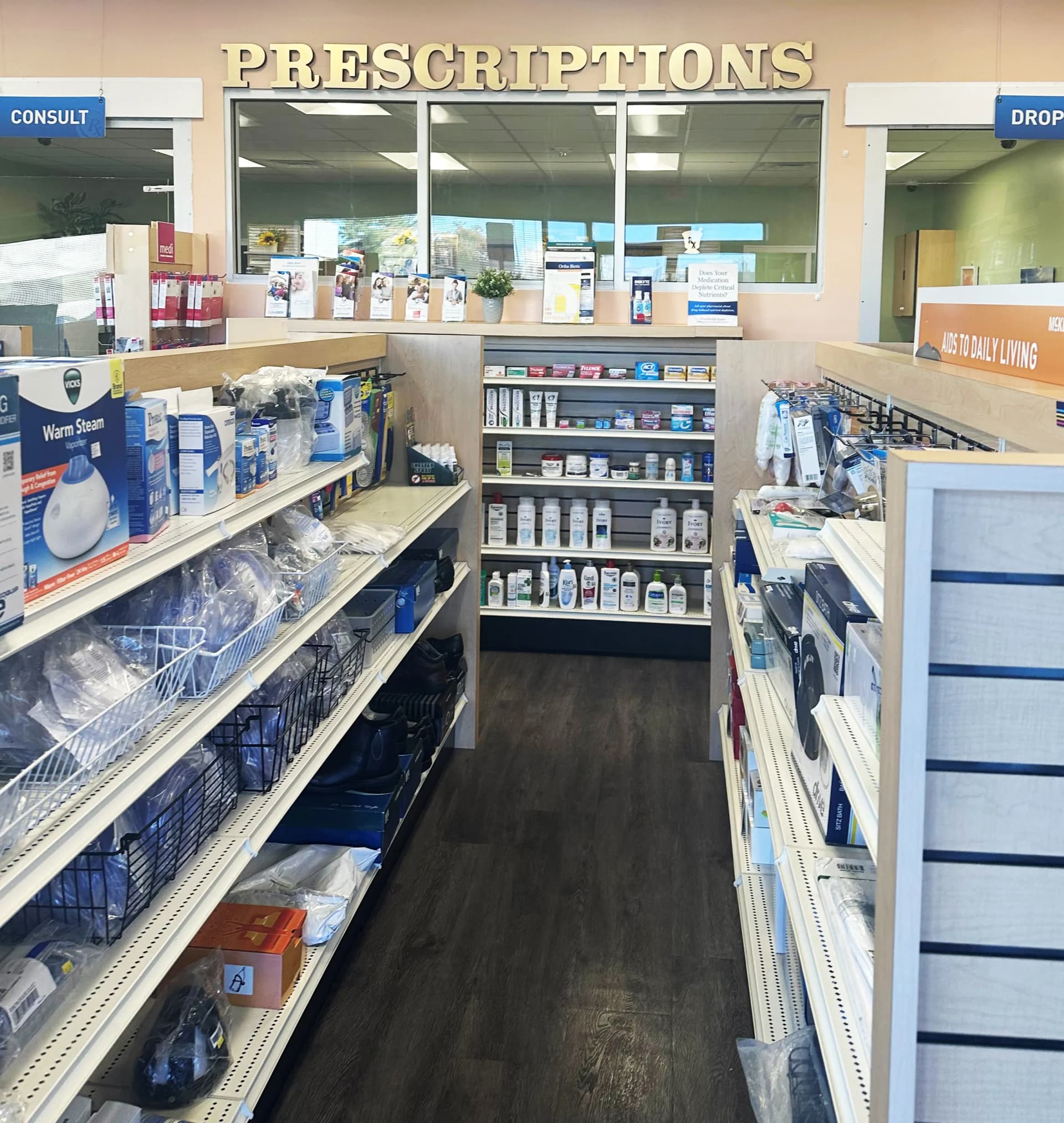 Pharmacist placing medication into a delivery bag